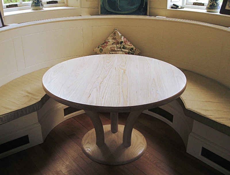 Circular limed ash dining table